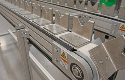Indexing Conveyor that moves products in a series of steps rather than a continuous flow.